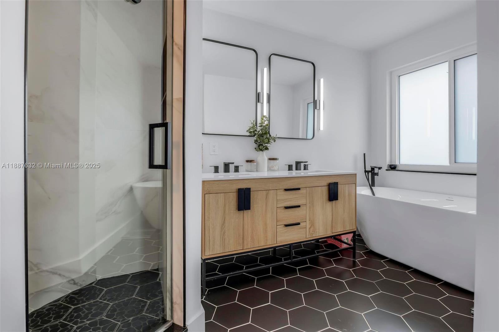 14836 Southwest 51st Street Davie, FL 33331 - Photo 18 of 34 a bathroom with a double vanity sink toilet and shower