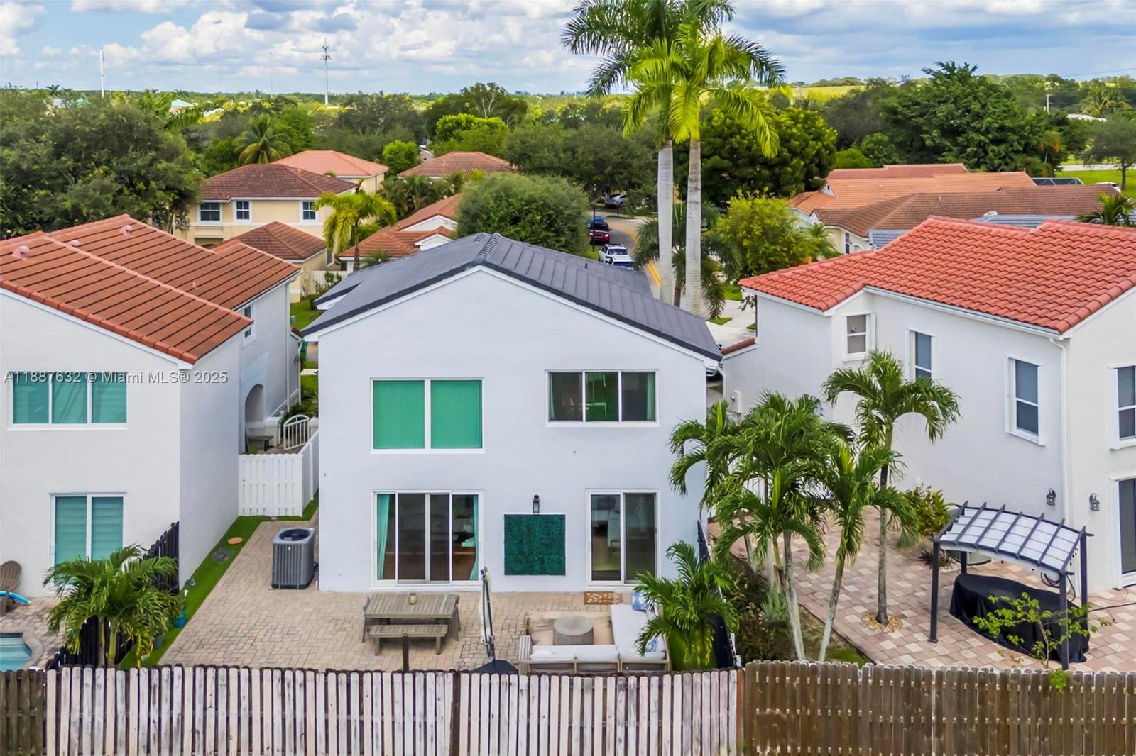 14836 Southwest 51st Street Davie, FL 33331 - Photo 27 of 34 a view of a house with a yard and plants