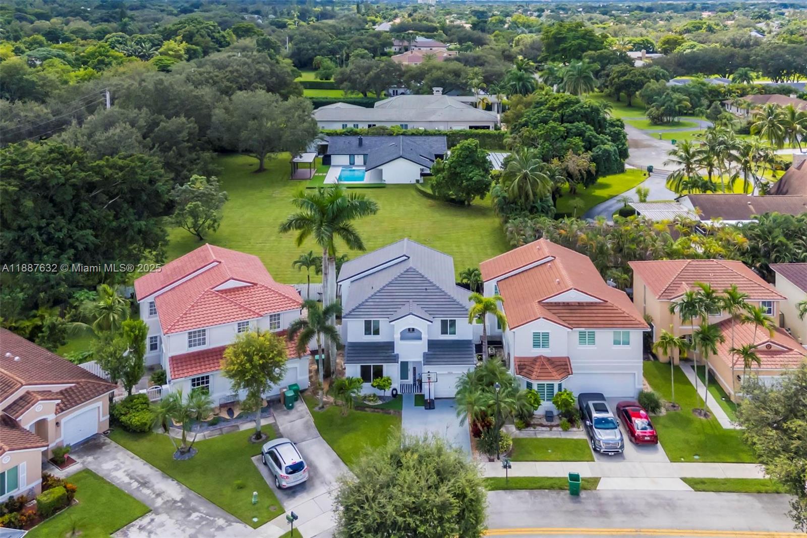 14836 Southwest 51st Street Davie, FL 33331 - Photo 29 of 34 an aerial view of multiple houses with yard