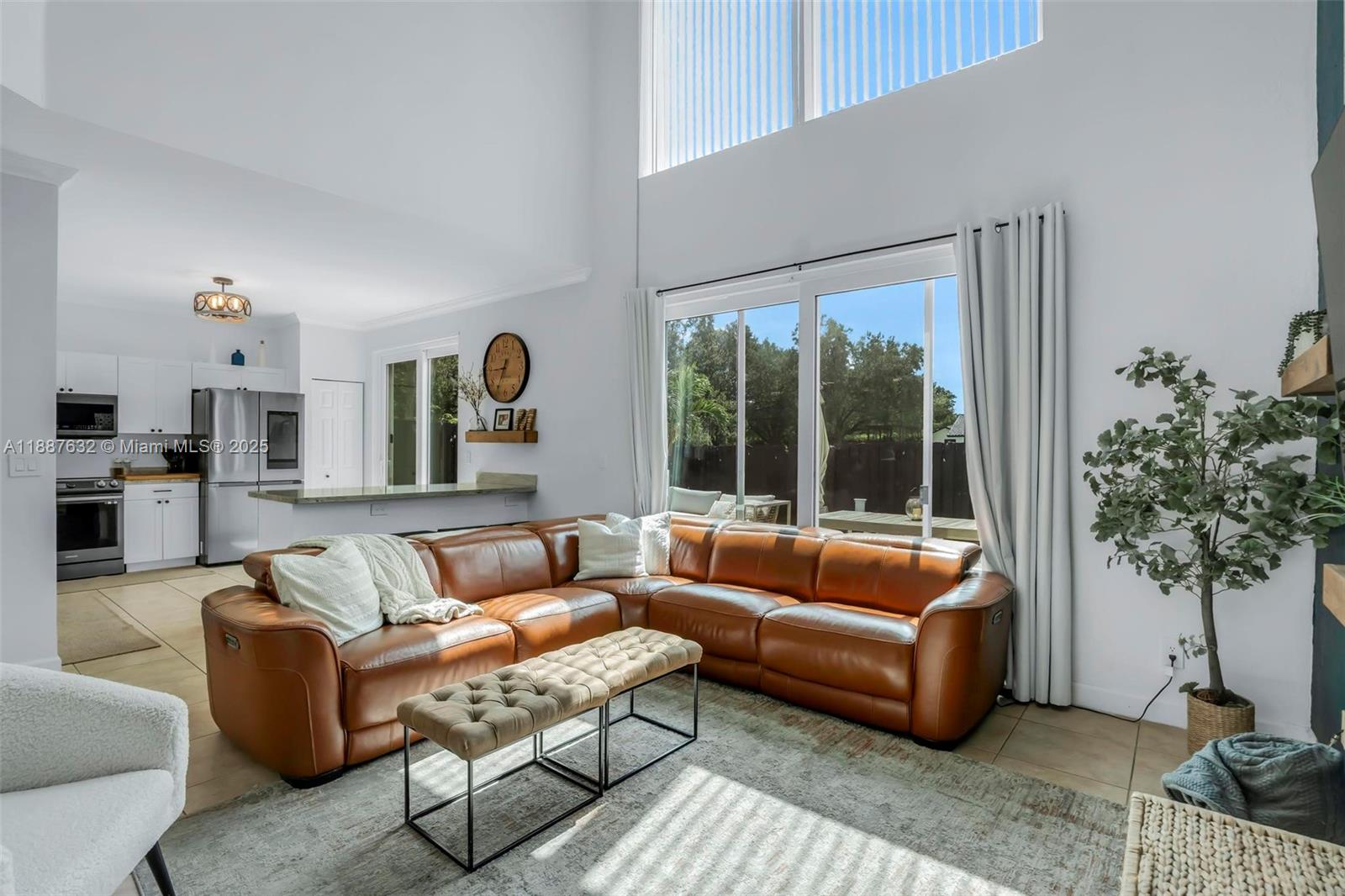 14836 Southwest 51st Street Davie, FL 33331 - Photo 3 of 34 a living room with furniture and a potted plant