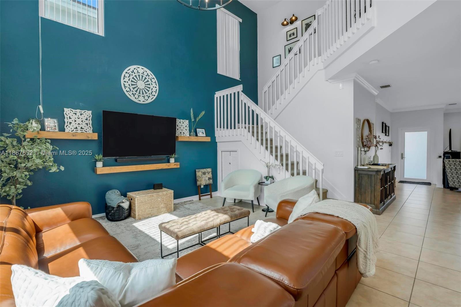 14836 Southwest 51st Street Davie, FL 33331 - Photo 4 of 34 a living room with furniture and a flat screen tv