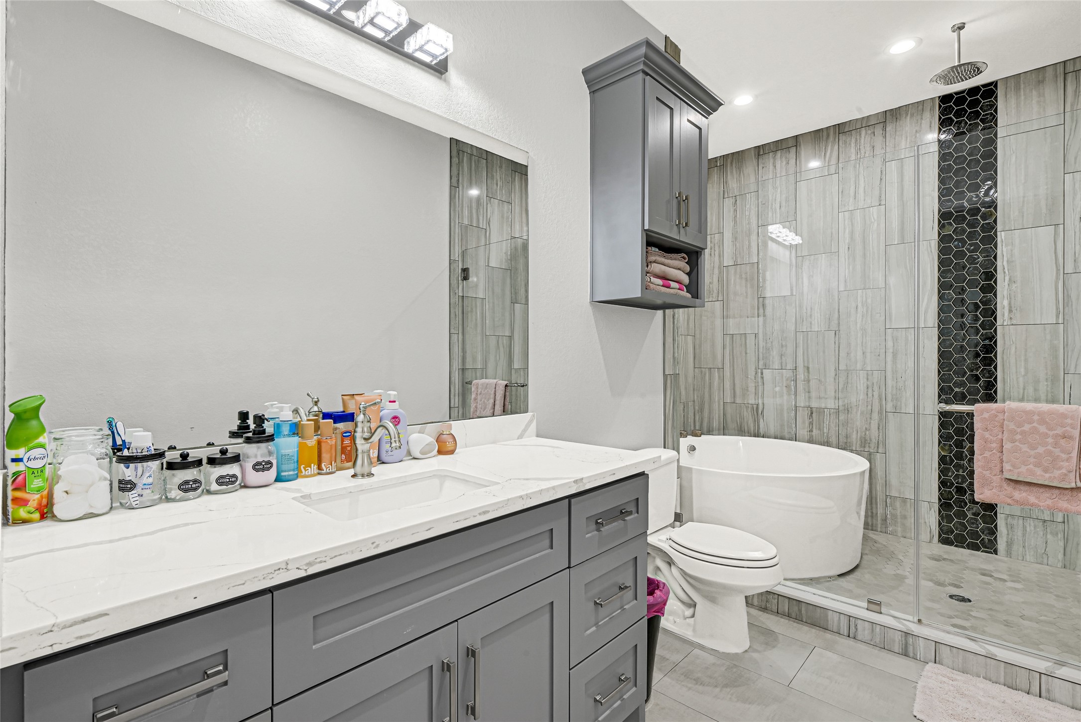 4821 1st Street Houston, TX 77504 - Photo 22 of 48 a bathroom with a sink a toilet and shower