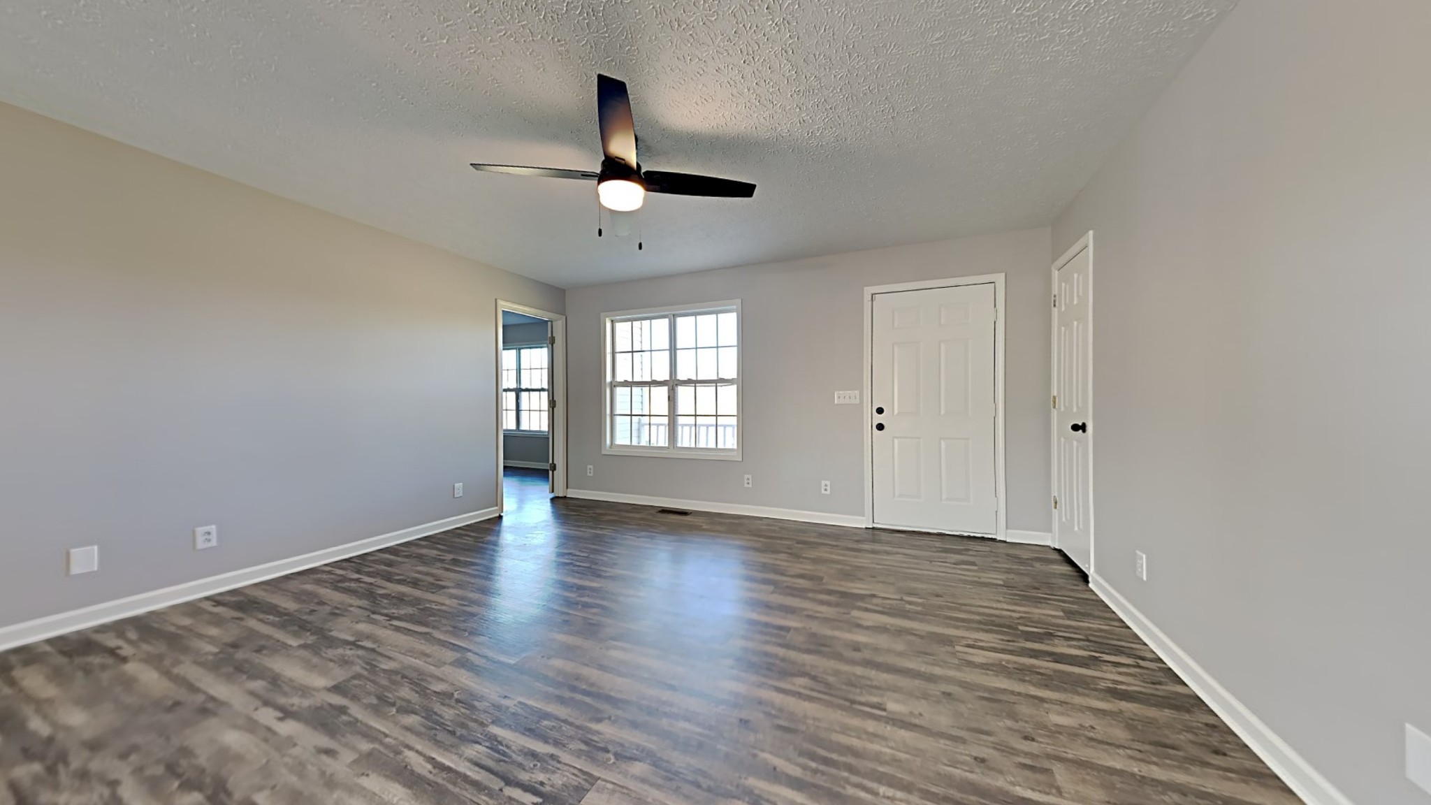 416 Jernigan Road Portland, TN 37148 - Photo 3 of 16 a view of an empty room with window and wooden floor