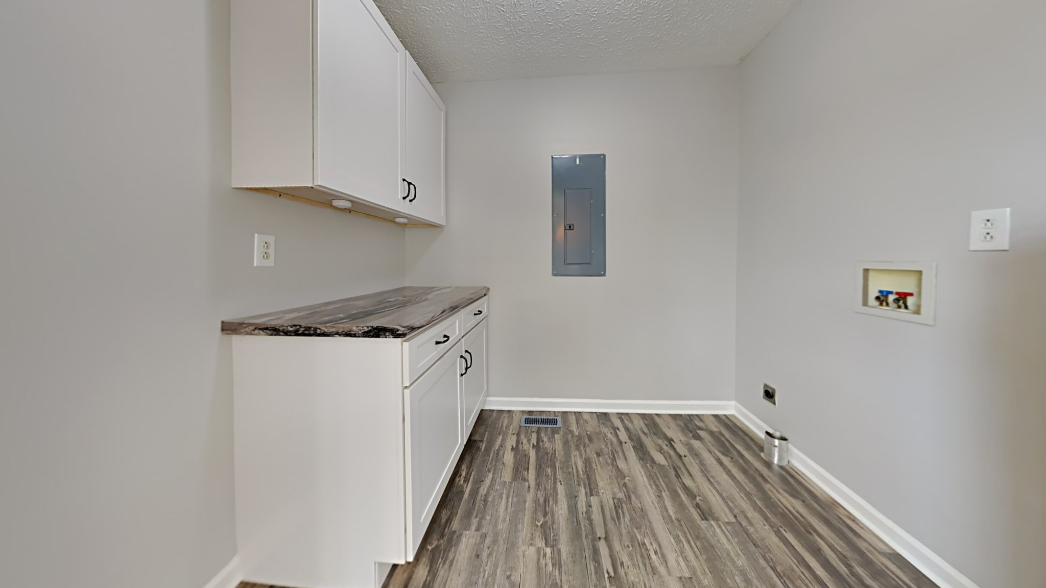 416 Jernigan Road Portland, TN 37148 - Photo 6 of 16 a view of a storage and utility room with wooden floor