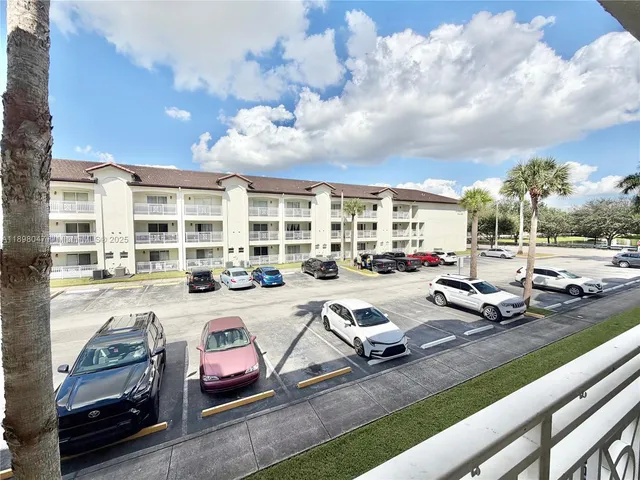 a view of a swimming pool with outdoor seating