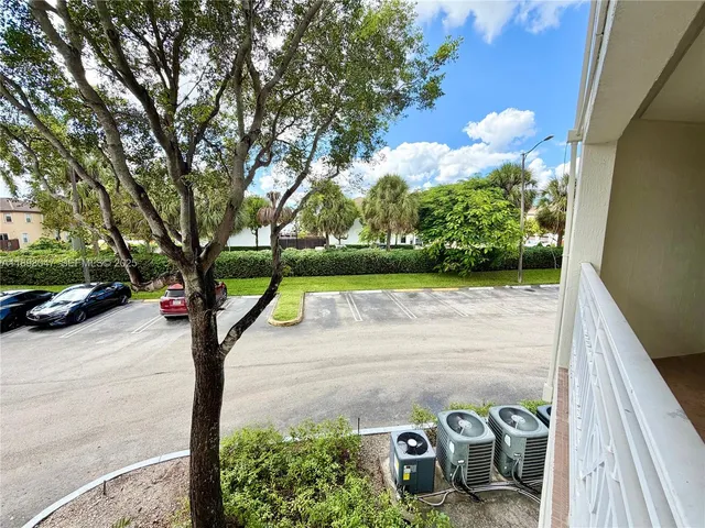 a view of a street with a building in the background