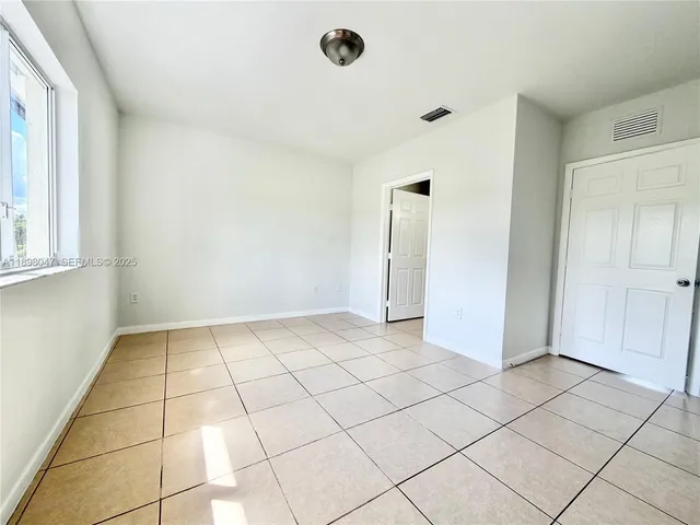 a view of an empty room and window