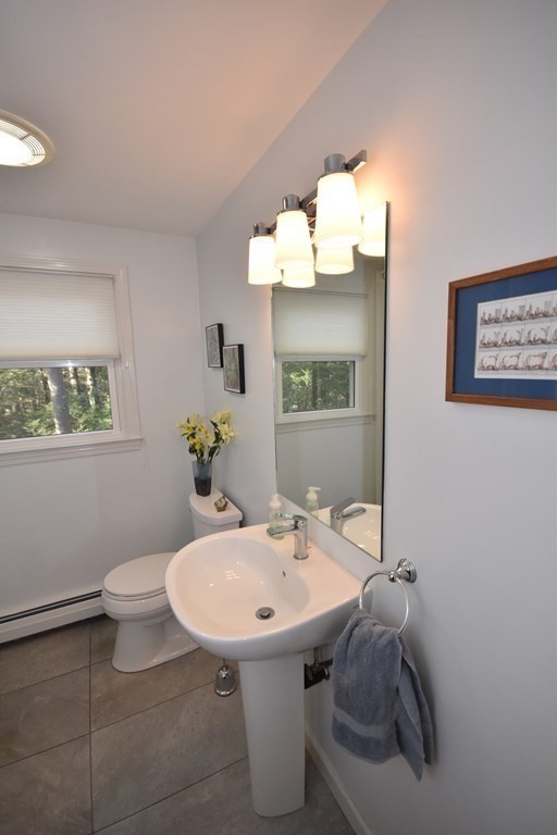 227 Heatherstone Road Amherst, MA 01002 - Photo 17 of 42 a bathroom with a sink and a mirror