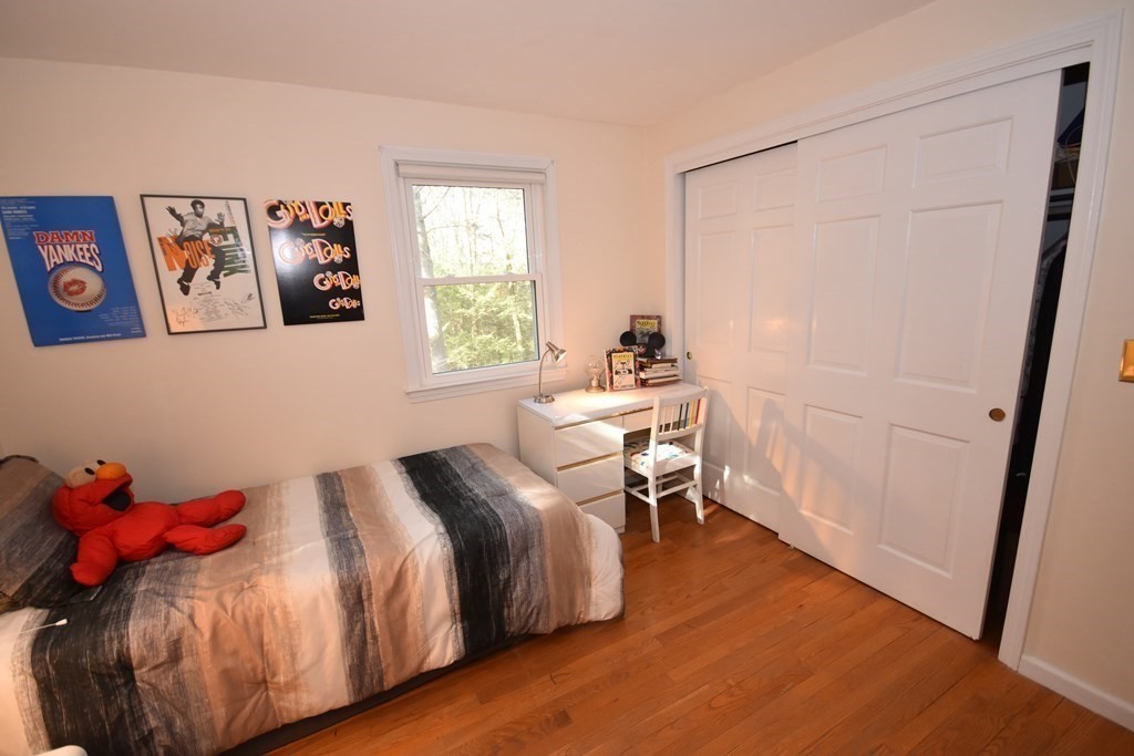 227 Heatherstone Road Amherst, MA 01002 - Photo 25 of 42 a bedroom with a bed and a window