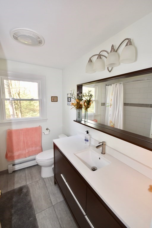227 Heatherstone Road Amherst, MA 01002 - Photo 29 of 42 a bathroom with a sink and a mirror