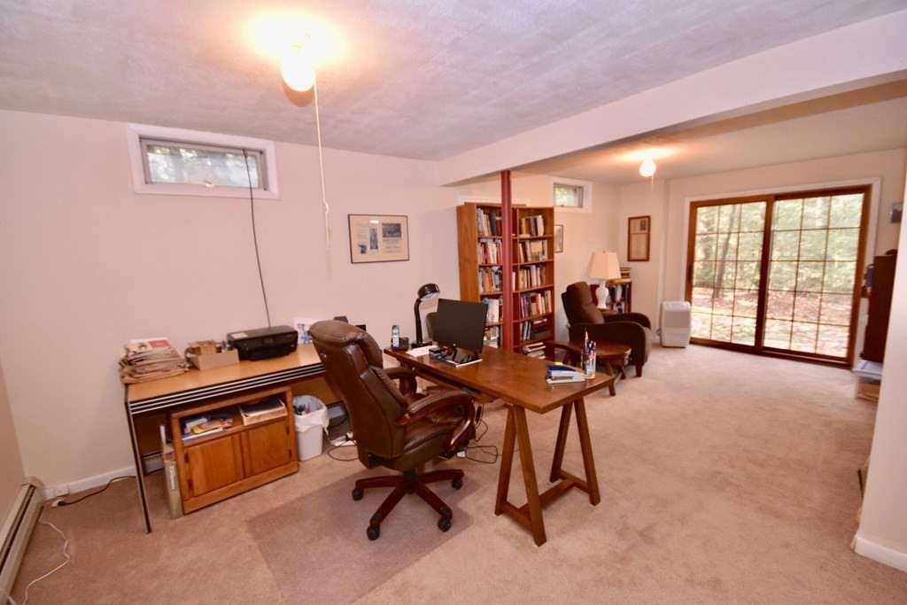 227 Heatherstone Road Amherst, MA 01002 - Photo 33 of 42 a view of a workspace with furniture and a window