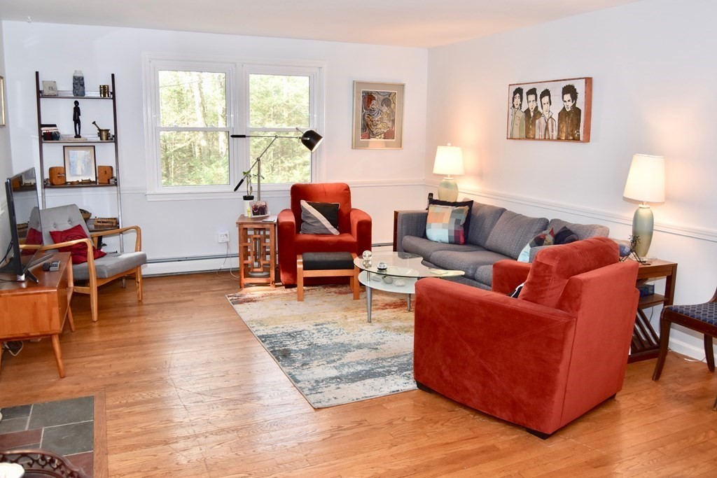 227 Heatherstone Road Amherst, MA 01002 - Photo 4 of 42 a living room with furniture and a window