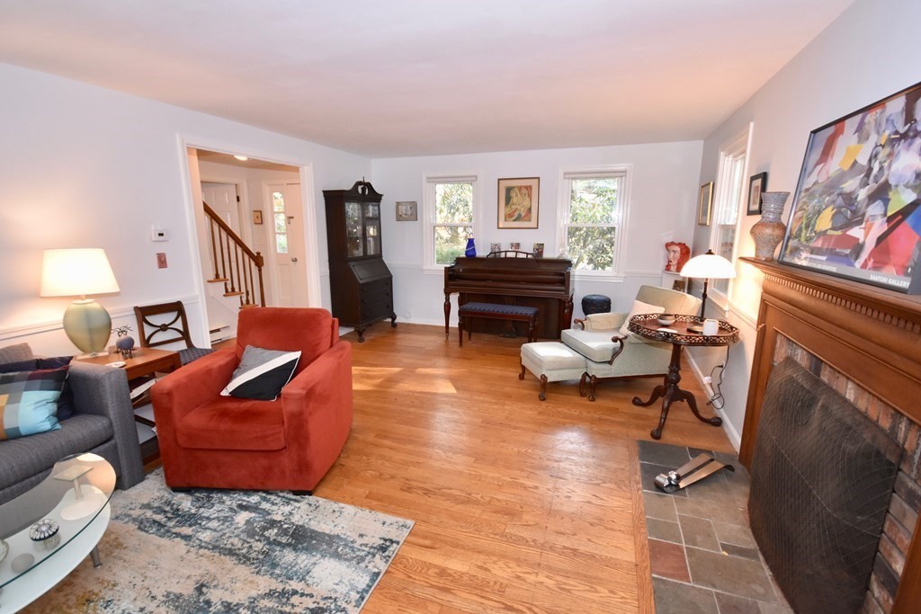 227 Heatherstone Road Amherst, MA 01002 - Photo 7 of 42 a living room with furniture and a fireplace