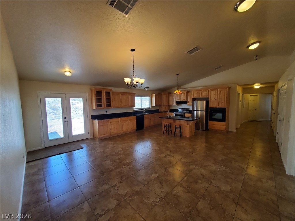 5272 Truman Lane Caliente, NV 89008 - Photo 42 of 43 An open floorplan merges the well-appointed kitchen with direct outdoor access.