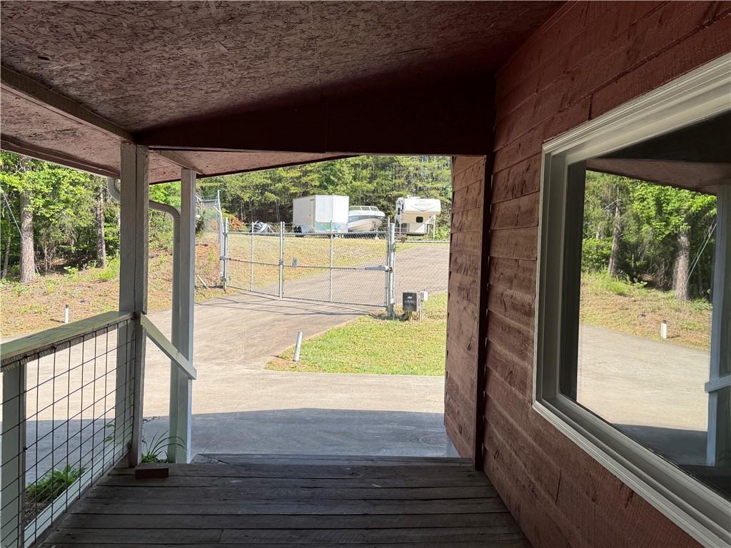 86 Robert Jones Road Dawsonville, GA 30534 - Photo 19 of 19 a view of a porch and wooden floor