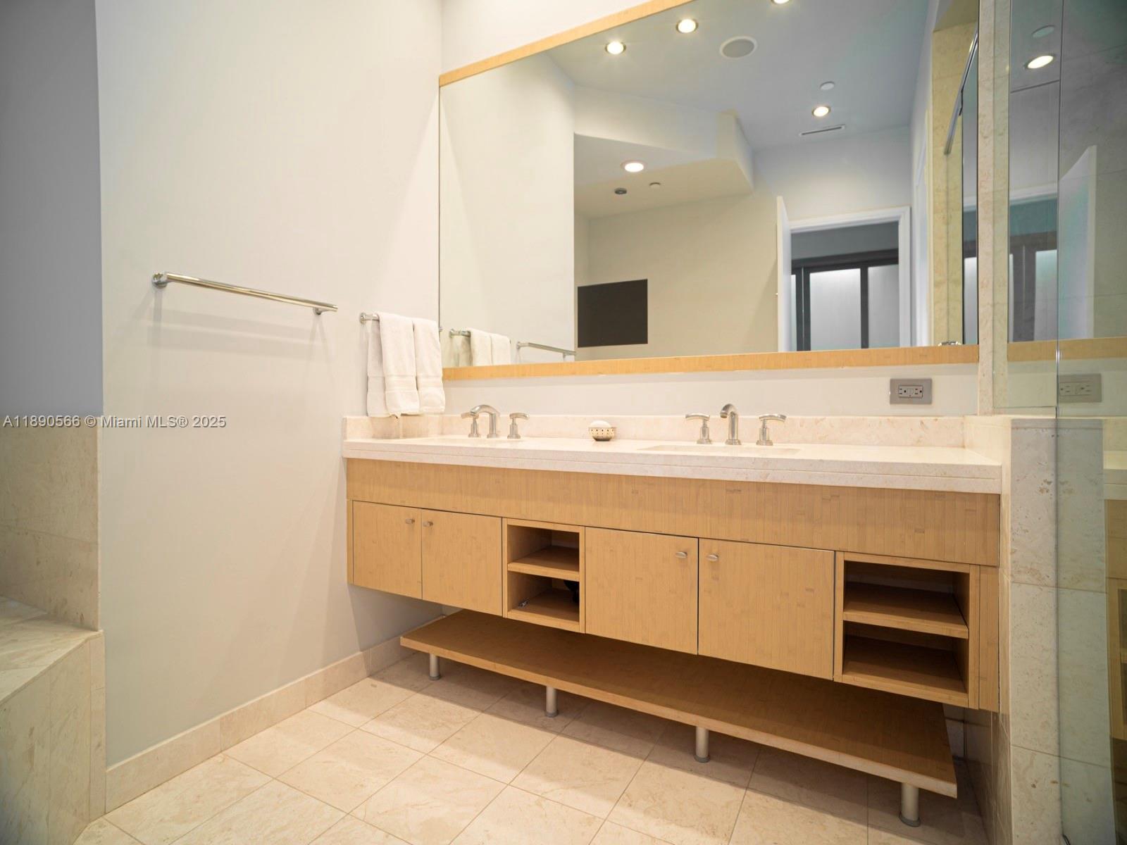 900 Brickell Key Boulevard, Unit 2204 Miami, FL 33131 - Photo 15 of 40 a bathroom with a sink double vanity and a mirror