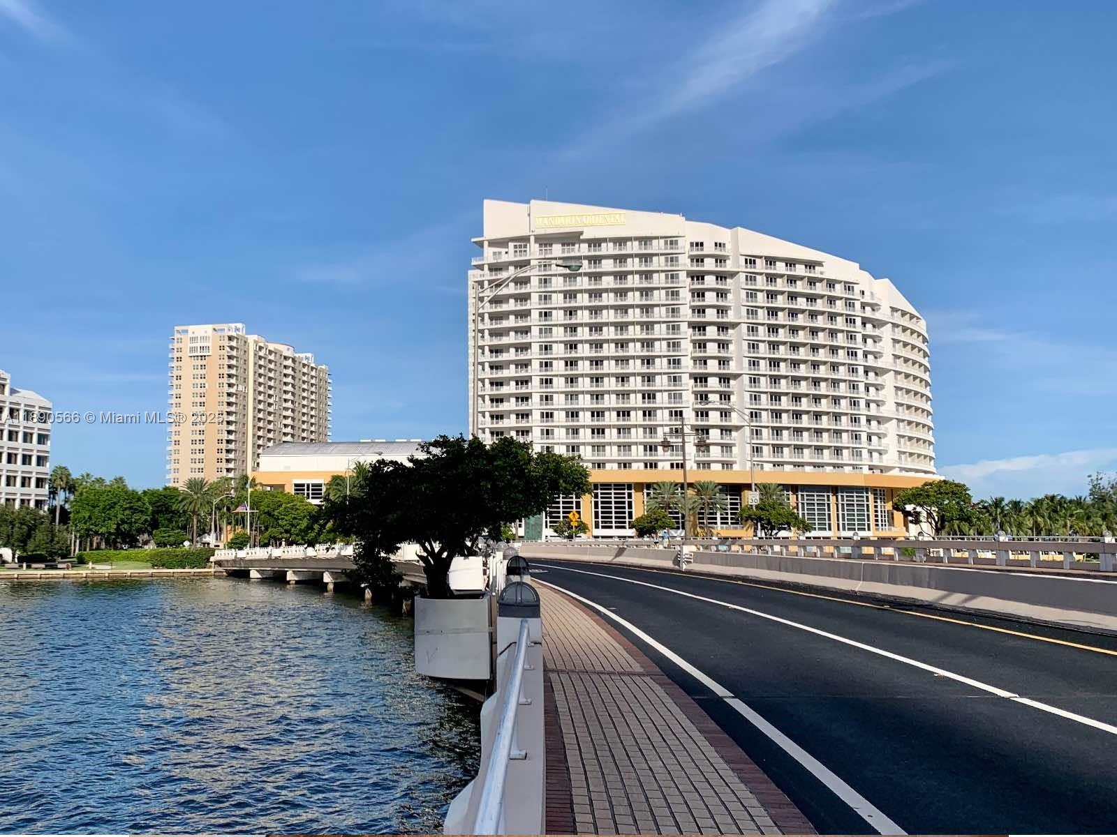 900 Brickell Key Boulevard, Unit 2204 Miami, FL 33131 - Photo 26 of 40 a view of a balcony with chairs