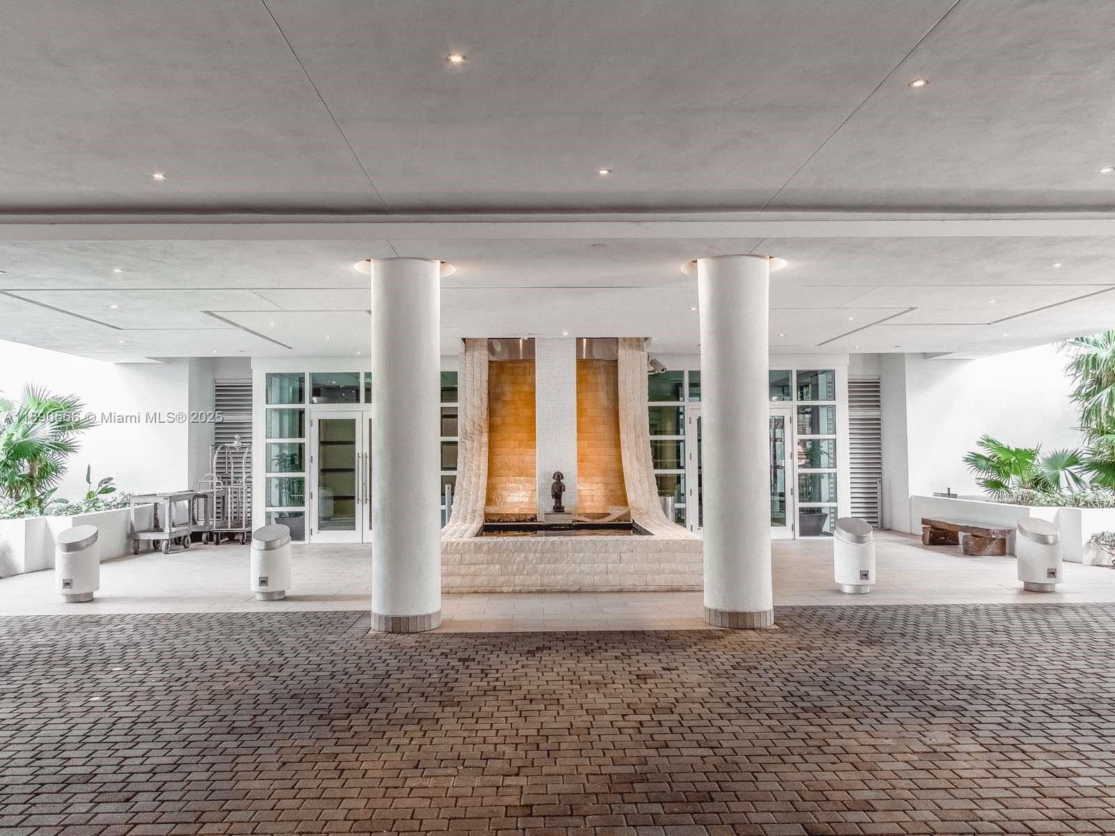 900 Brickell Key Boulevard, Unit 2204 Miami, FL 33131 - Photo 30 of 40 a front view of a house with a porch