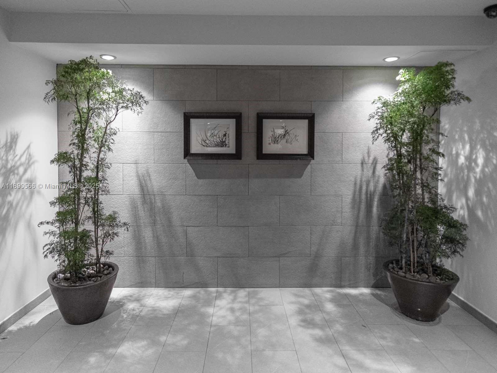 900 Brickell Key Boulevard, Unit 2204 Miami, FL 33131 - Photo 34 of 40 a potted plant sitting in front of a house