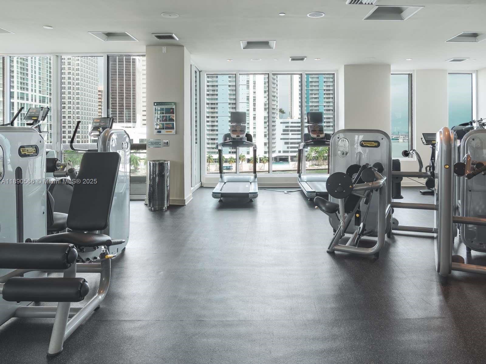900 Brickell Key Boulevard, Unit 2204 Miami, FL 33131 - Photo 35 of 40 a view of a room with gym equipment
