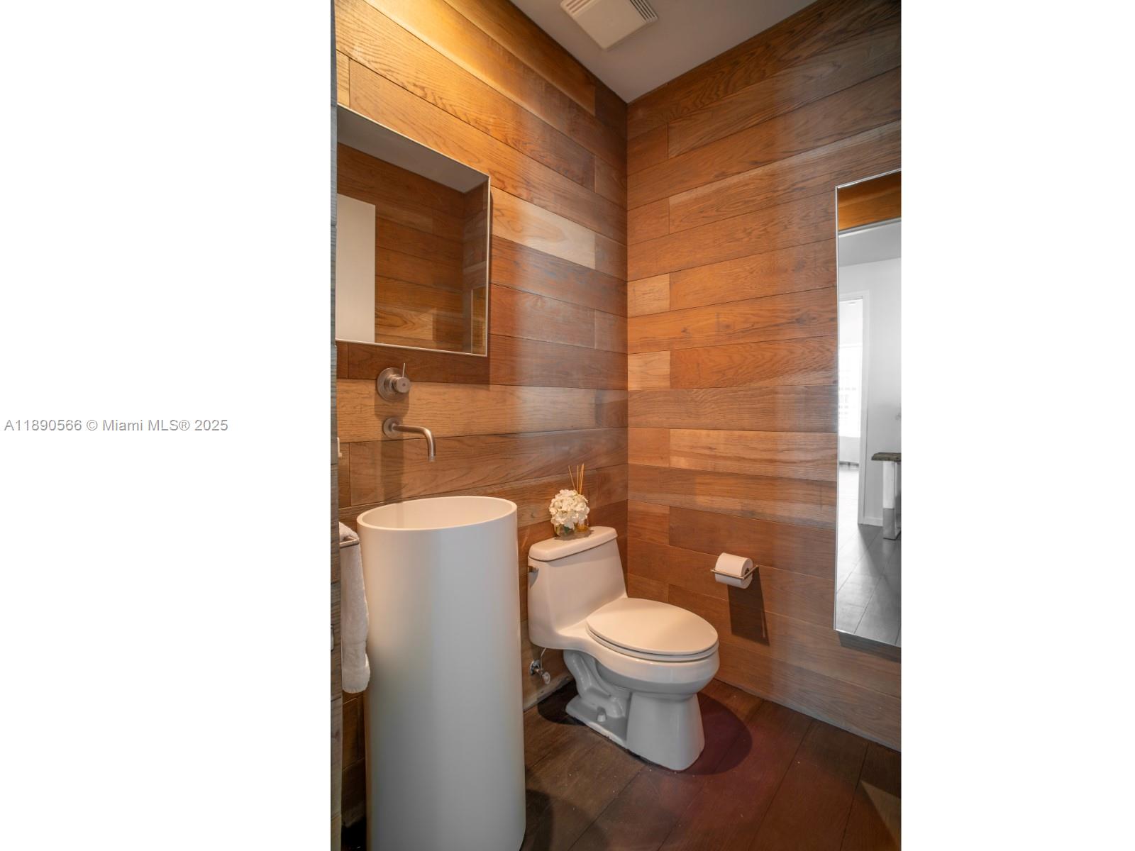 900 Brickell Key Boulevard, Unit 2204 Miami, FL 33131 - Photo 10 of 40 a bathroom with a toilet and a shower