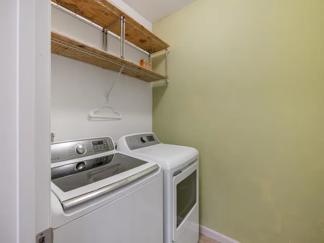 a view of a room with a wooden floor and cabinet