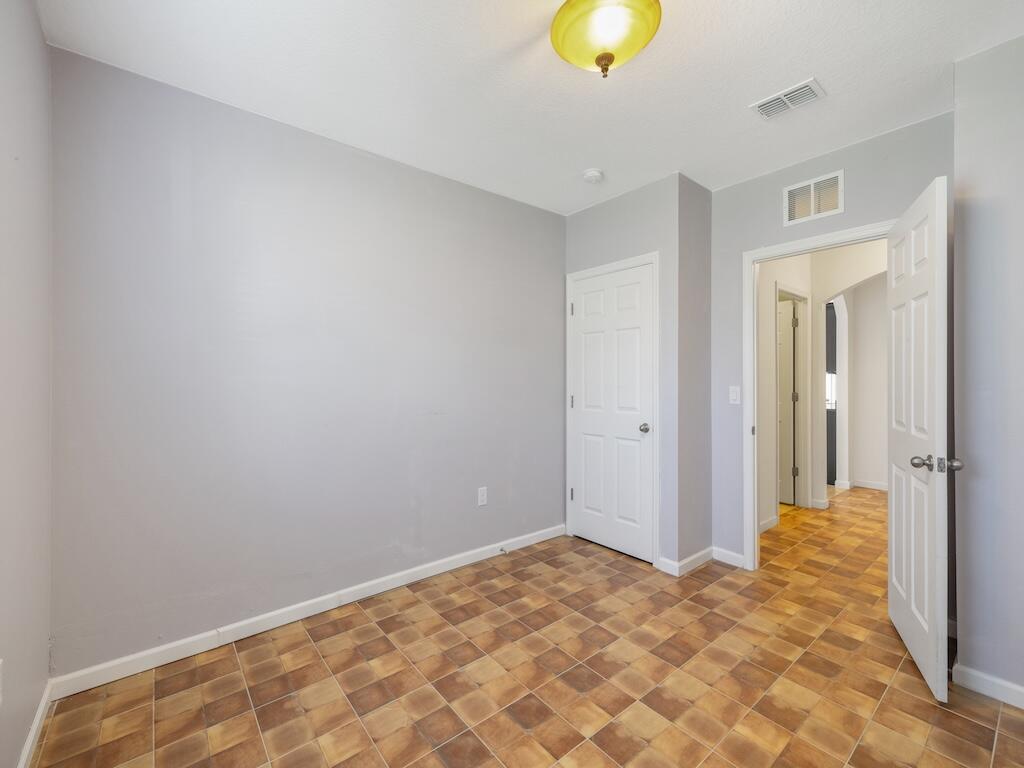 1440 Lexington Square Southwest Vero Beach, FL 32962 - Photo 24 of 41 a view of a room with a wooden floor and cabinet