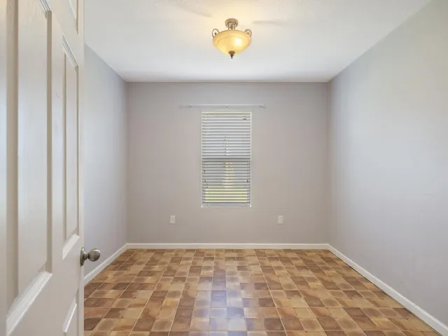a view of a chandelier fan and closet in a room