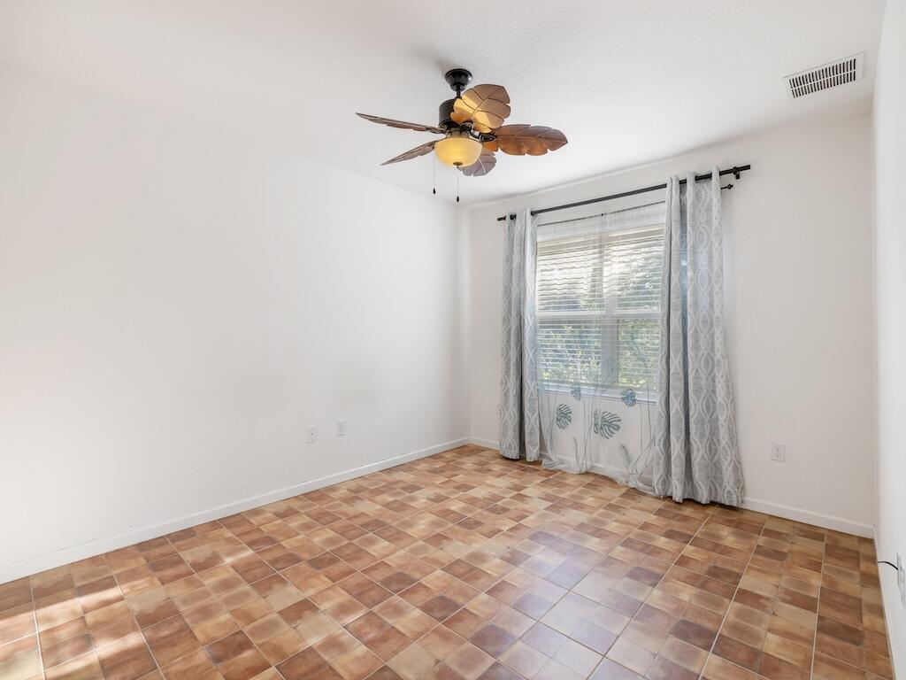1440 Lexington Square Southwest Vero Beach, FL 32962 - Photo 26 of 41 a view of a chandelier fan and closet in a room