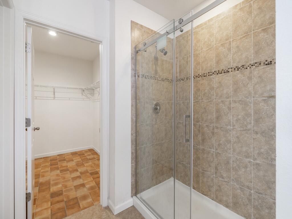 1440 Lexington Square Southwest Vero Beach, FL 32962 - Photo 29 of 41 a bathroom with a glass shower door