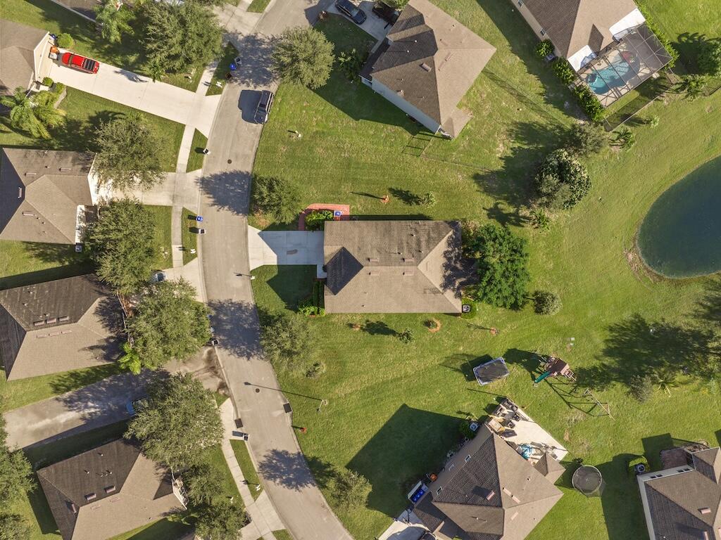 1440 Lexington Square Southwest Vero Beach, FL 32962 - Photo 34 of 41 an aerial view of a house with a yard basket ball court and outdoor seating