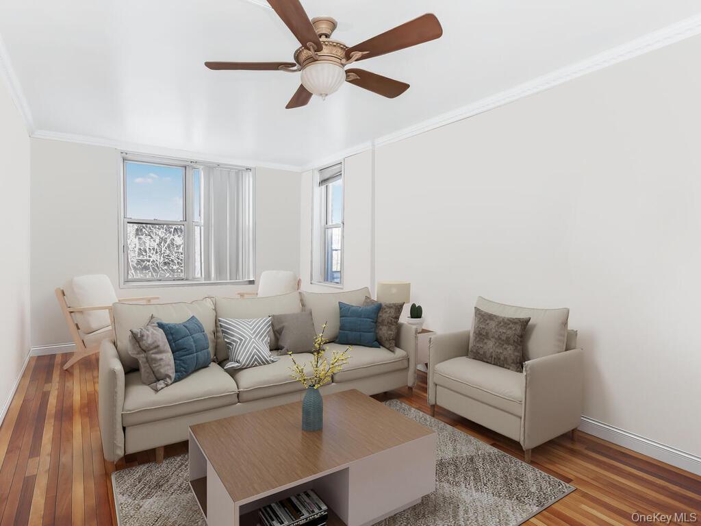 1475 Thieriot Avenue, Unit 5N Bronx, NY 10460 - Photo 12 of 22 a living room with furniture and a rug
