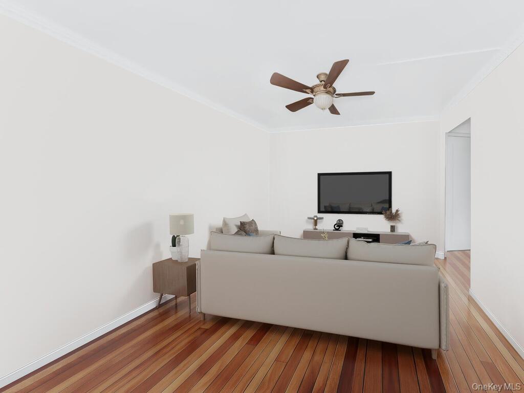 1475 Thieriot Avenue, Unit 5N Bronx, NY 10460 - Photo 14 of 22 a living room with furniture and a flat screen tv