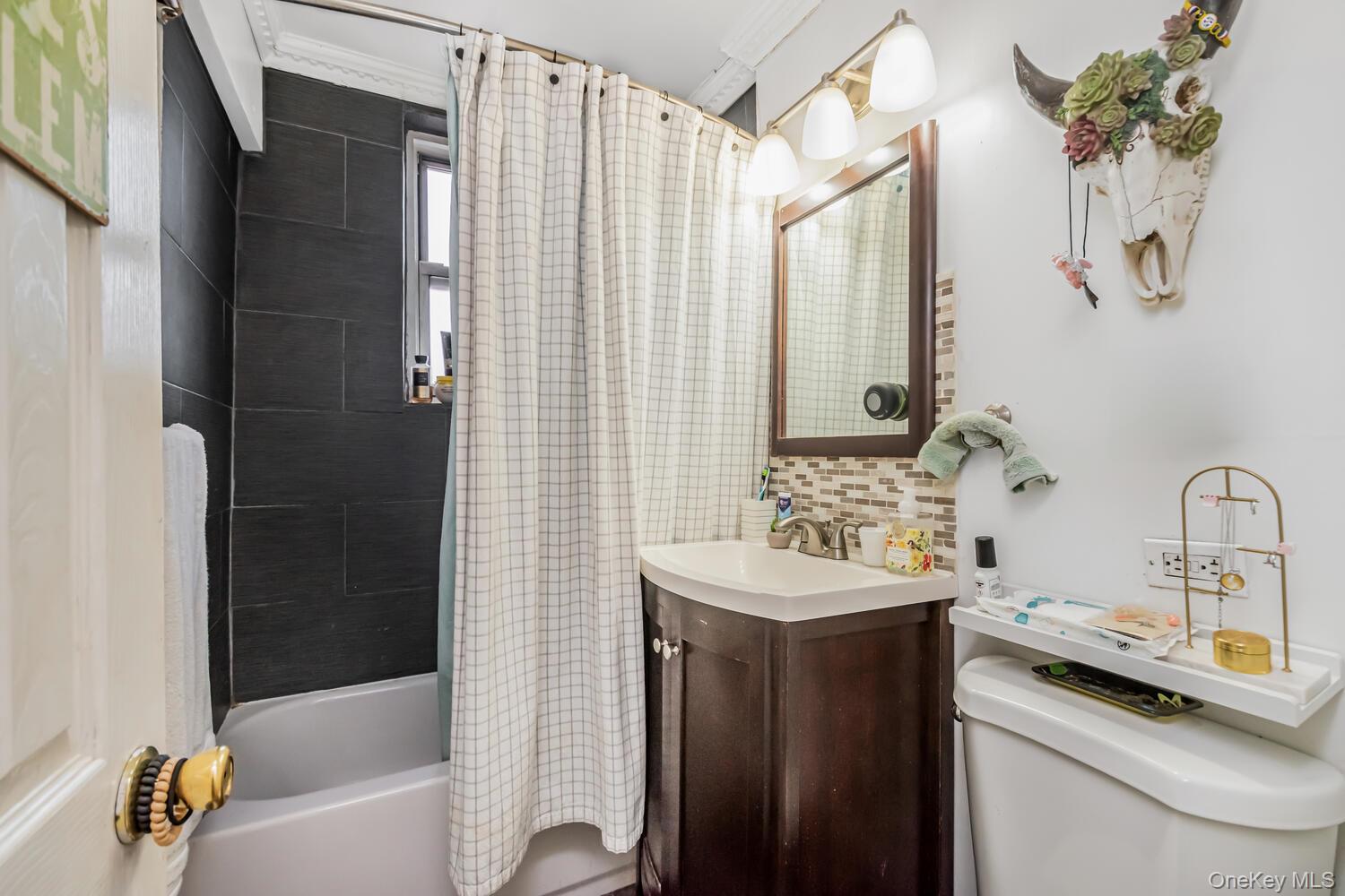 1475 Thieriot Avenue, Unit 5N Bronx, NY 10460 - Photo 15 of 22 a bathroom with a sink a toilet and shower