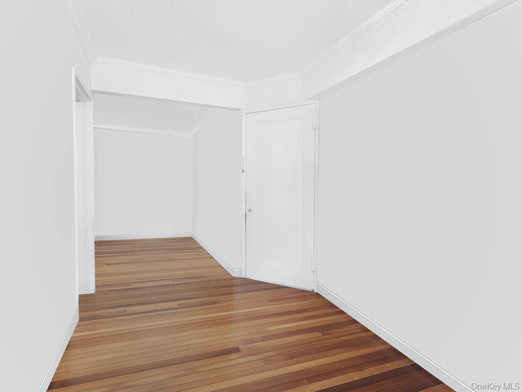 1475 Thieriot Avenue, Unit 5N Bronx, NY 10460 - Photo 17 of 22 a view of a room with wooden floor