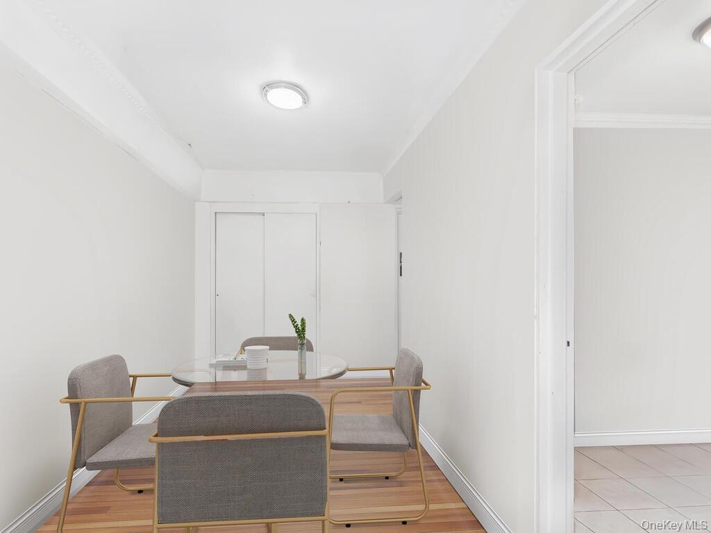 1475 Thieriot Avenue, Unit 5N Bronx, NY 10460 - Photo 5 of 22 a living room with furniture and a window