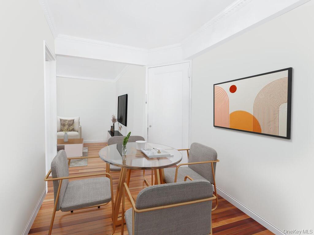 1475 Thieriot Avenue, Unit 5N Bronx, NY 10460 - Photo 6 of 22 a dining room with furniture and wooden floor