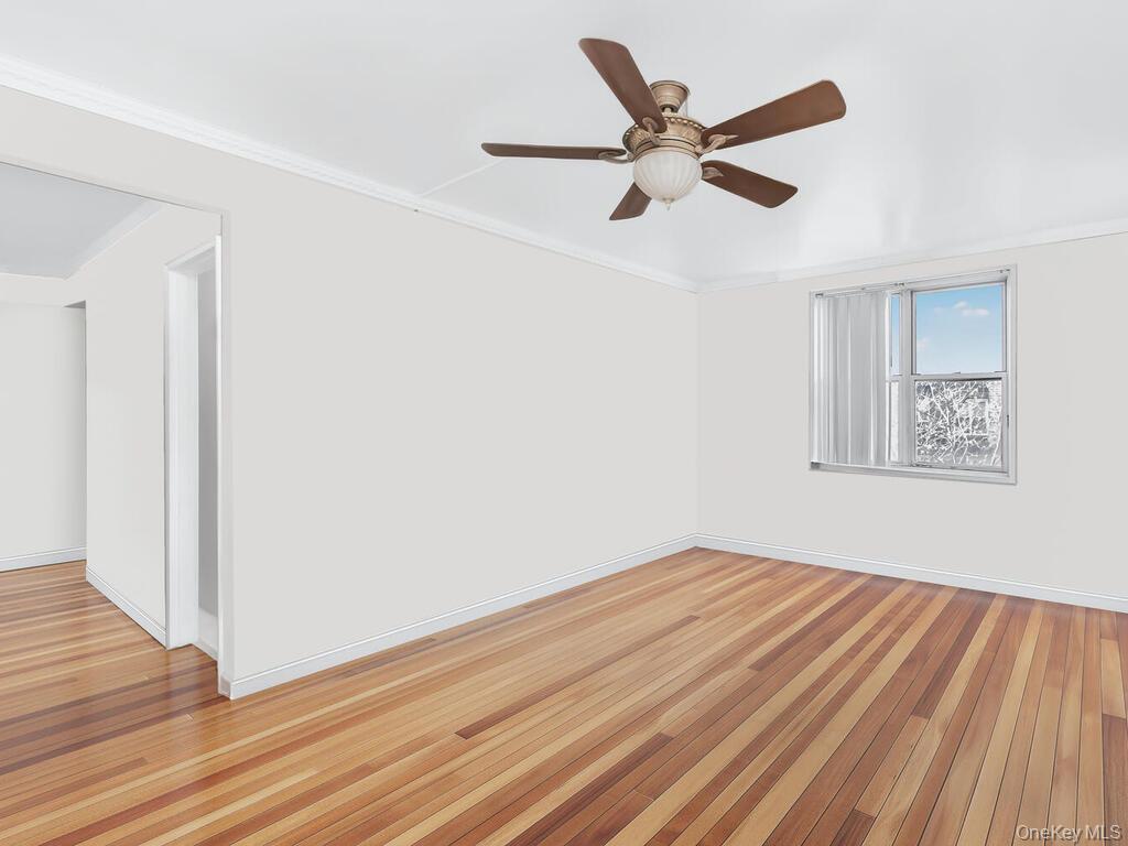 1475 Thieriot Avenue, Unit 5N Bronx, NY 10460 - Photo 9 of 22 wooden floor in an empty room