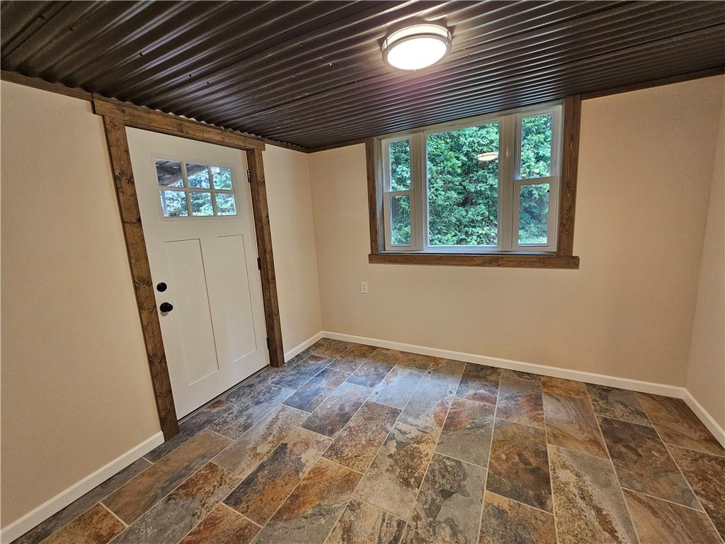 946 Herman Road Butler, PA 16002 - Photo 26 of 34 Lower level mudroom - leads to back covered patio and yard.