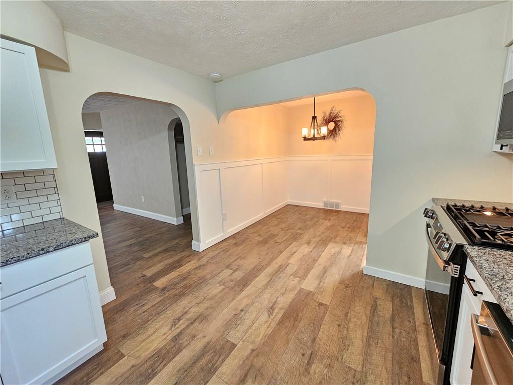 Kitchen adjoins dining area and is open to living room.