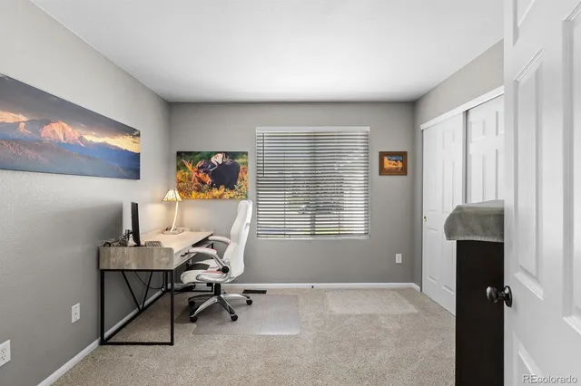 a work room with furniture and a window