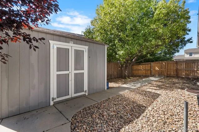 a house with garden in front of it