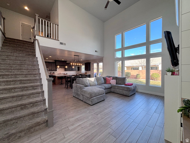 429 East Treasure Road Washington, UT 84780 - Photo 10 of 36 Living room with light wood-style floors, a high ceiling, a ceiling fan, and recessed lighting