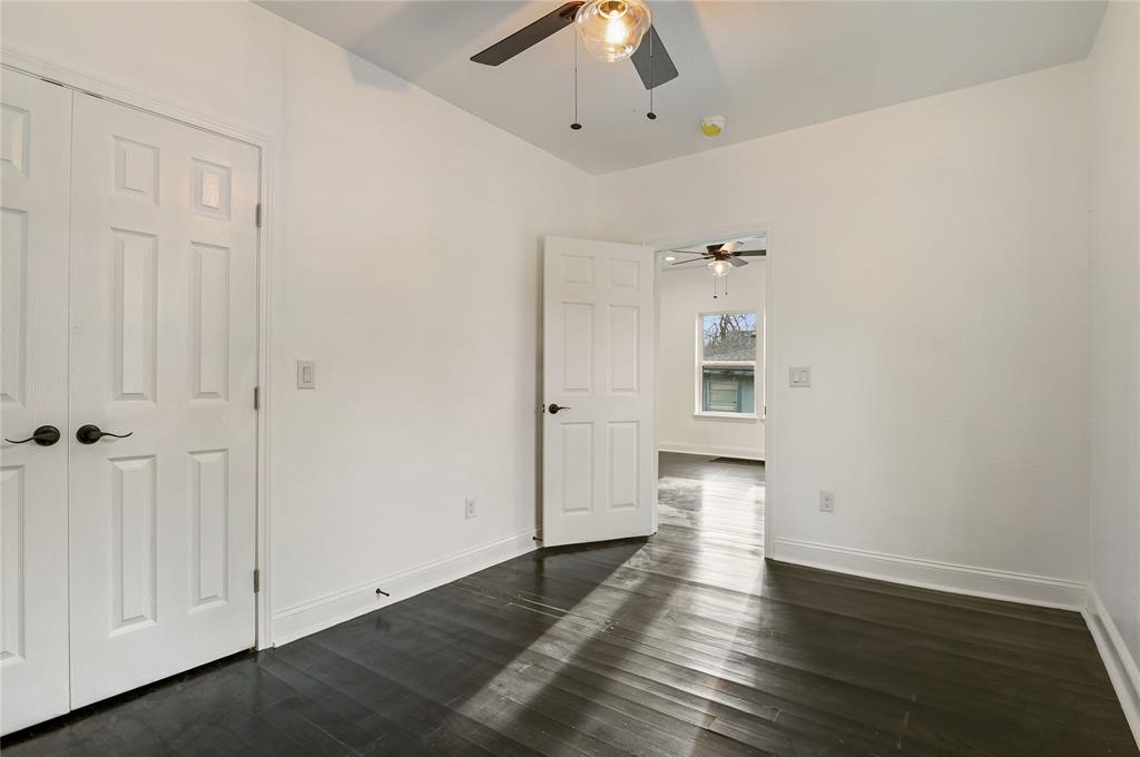 1106 West Chestnut Street Denison, TX 75020 - Photo 15 of 38 Unfurnished room with dark wood-type flooring and ceiling fan
