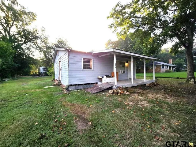 a backyard of a house with seating space