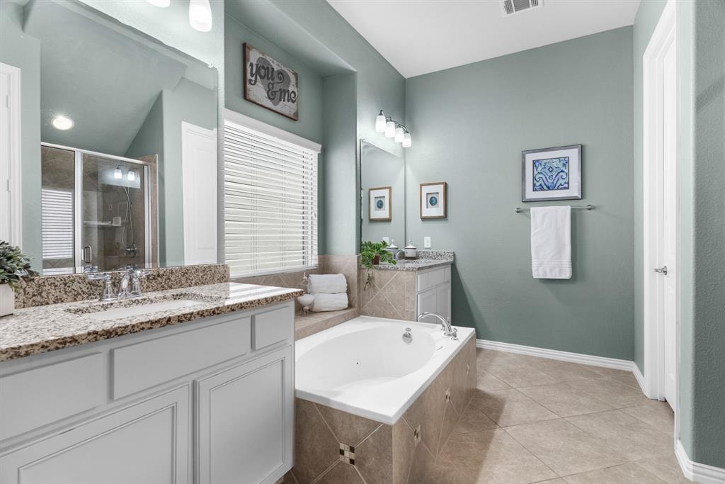 5604 Datewood Lane McKinney, TX 75071 - Photo 19 of 40 a bathroom with a granite countertop sink and a mirror
