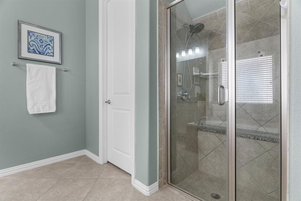 5604 Datewood Lane McKinney, TX 75071 - Photo 20 of 40 a bathroom with a shower
