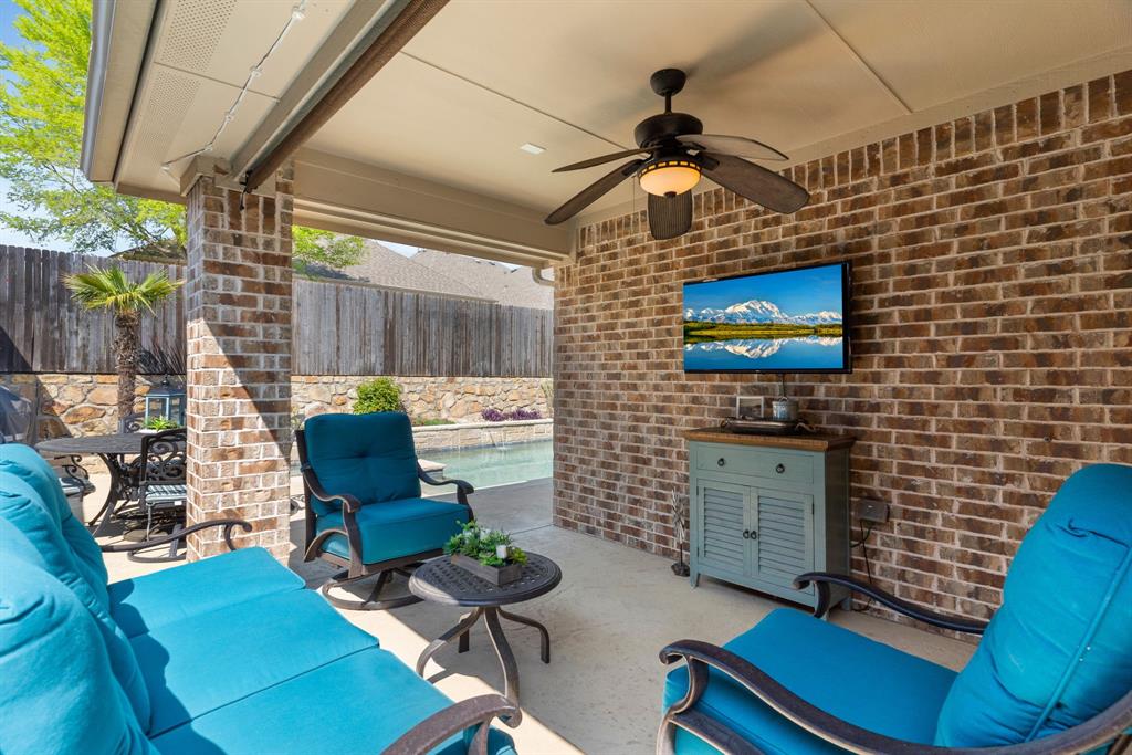 5604 Datewood Lane McKinney, TX 75071 - Photo 28 of 40 a work room with furniture and a flat screen tv