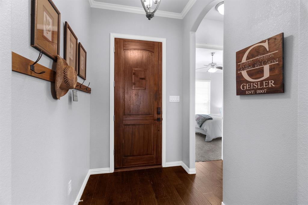 5604 Datewood Lane McKinney, TX 75071 - Photo 3 of 40 a view of an entryway with wooden floor