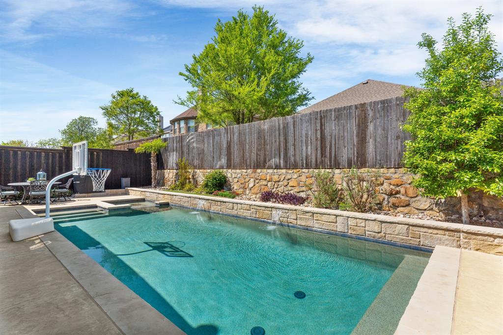 5604 Datewood Lane McKinney, TX 75071 - Photo 31 of 40 a view of backyard with swimming pool and furniture